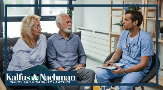 Male doctor communicating with senior couple about their medical condition during home visit.