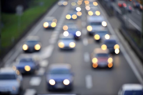 blurry cars driving down a highway