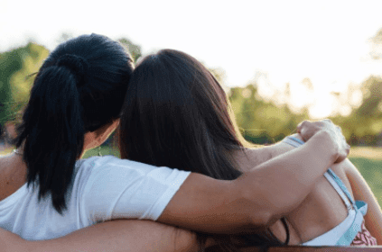 Two women hugging